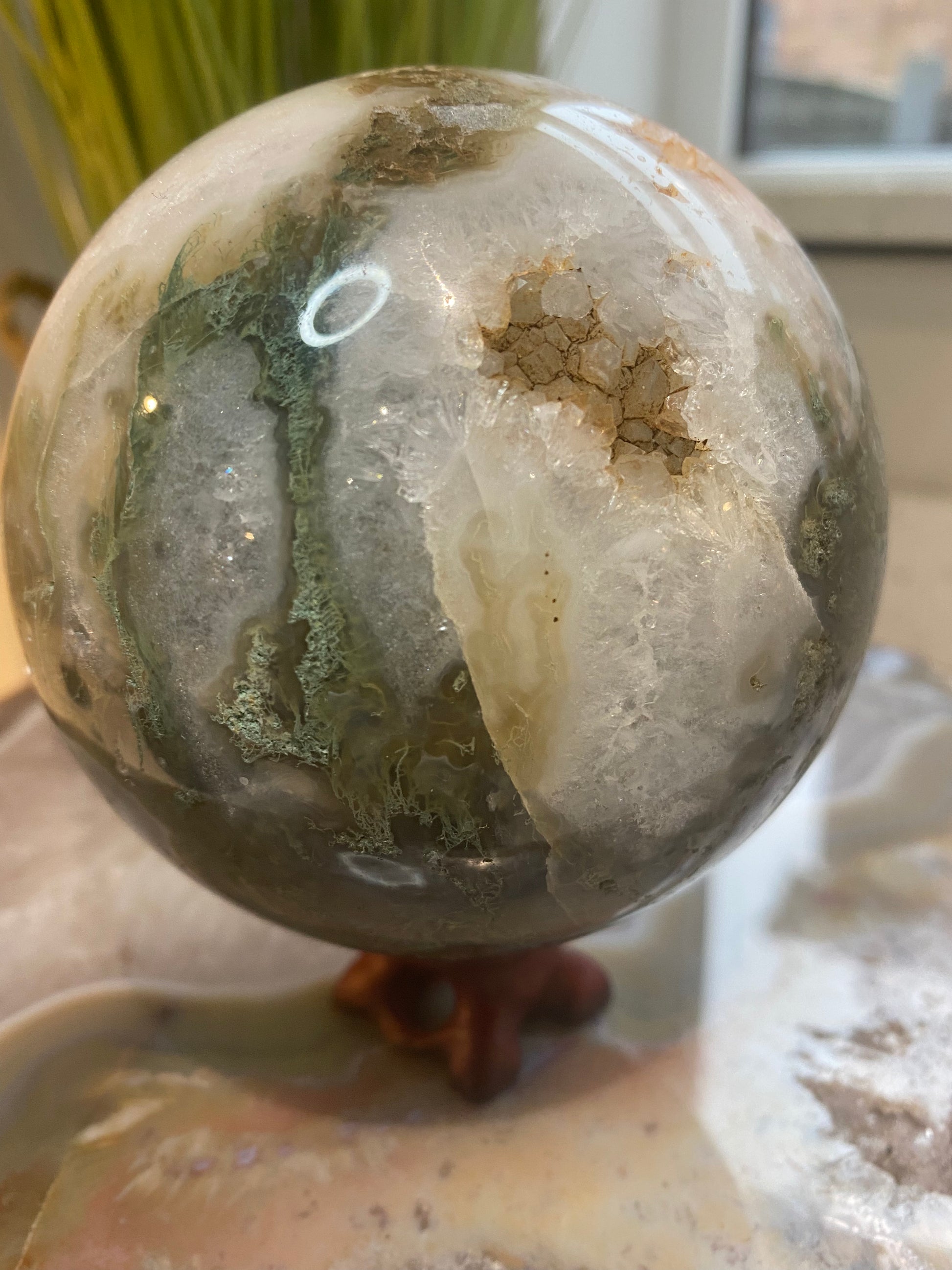 Moss agate sphere with Druze