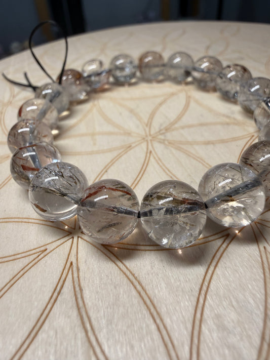 Red rutile in clear quartz
